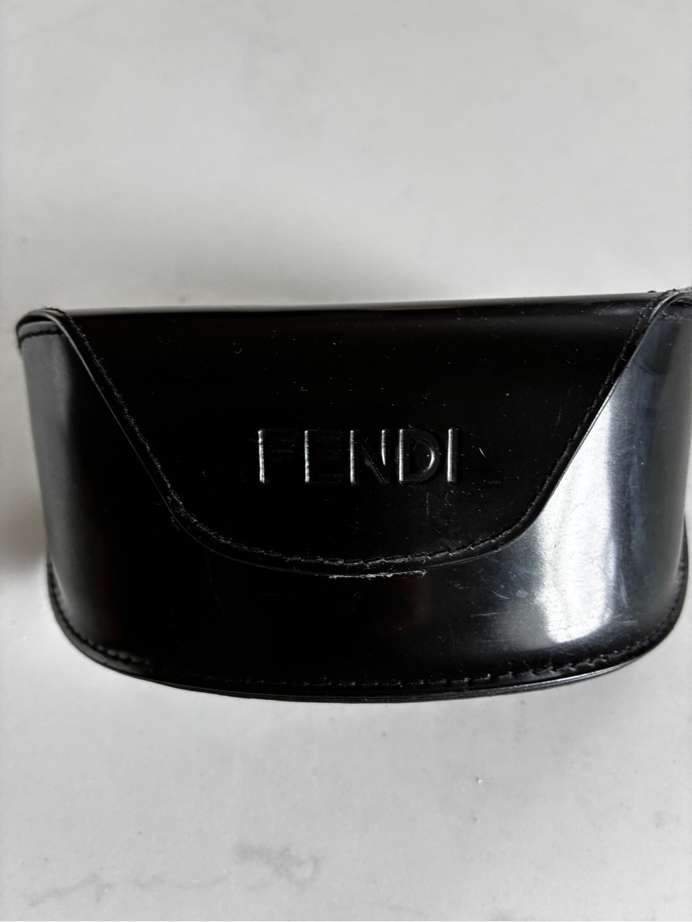Fendi sleek sunglasses with Swarovski crystals embedded in logo.